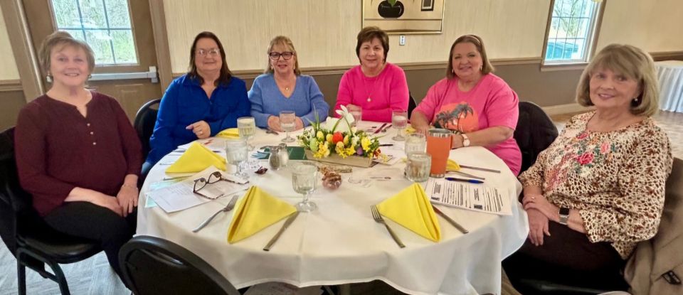 Six Mahoning Valley Republican Women’s Club members seated around a table at a luncheon.