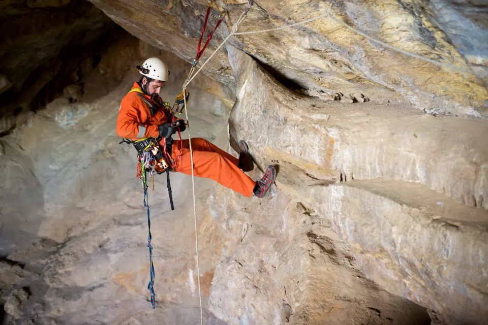 Vistacreate 199919934 stock photo speleologist performing rope maneuvers cave zaragoza province aragon spain