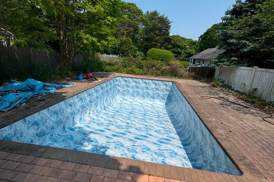 Rectangular inground pool with new marbled liner and brick paver patio in Long Island NY
