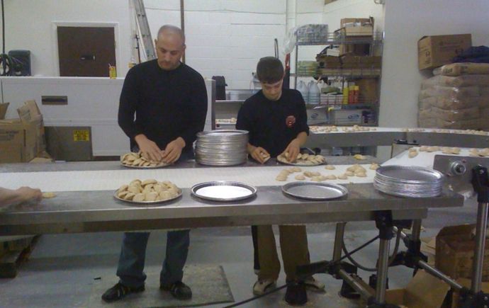 Toni's Own Cookies employees preparing cookies in the factory