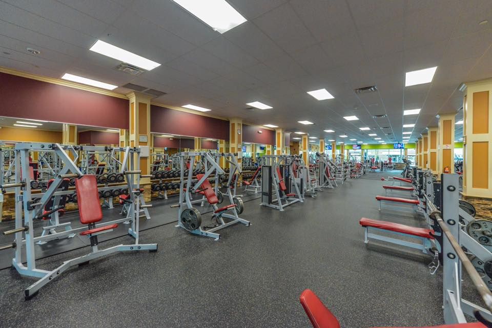 Wide shot of of different machines and benches at Maximus Gym in Riverhead