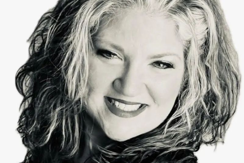 Black-and-white portrait of singer Stacy Wynette smiling