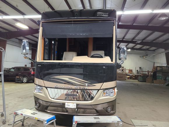 Newmar Dutch Star motorhome prepared for professional windshield replacement service.