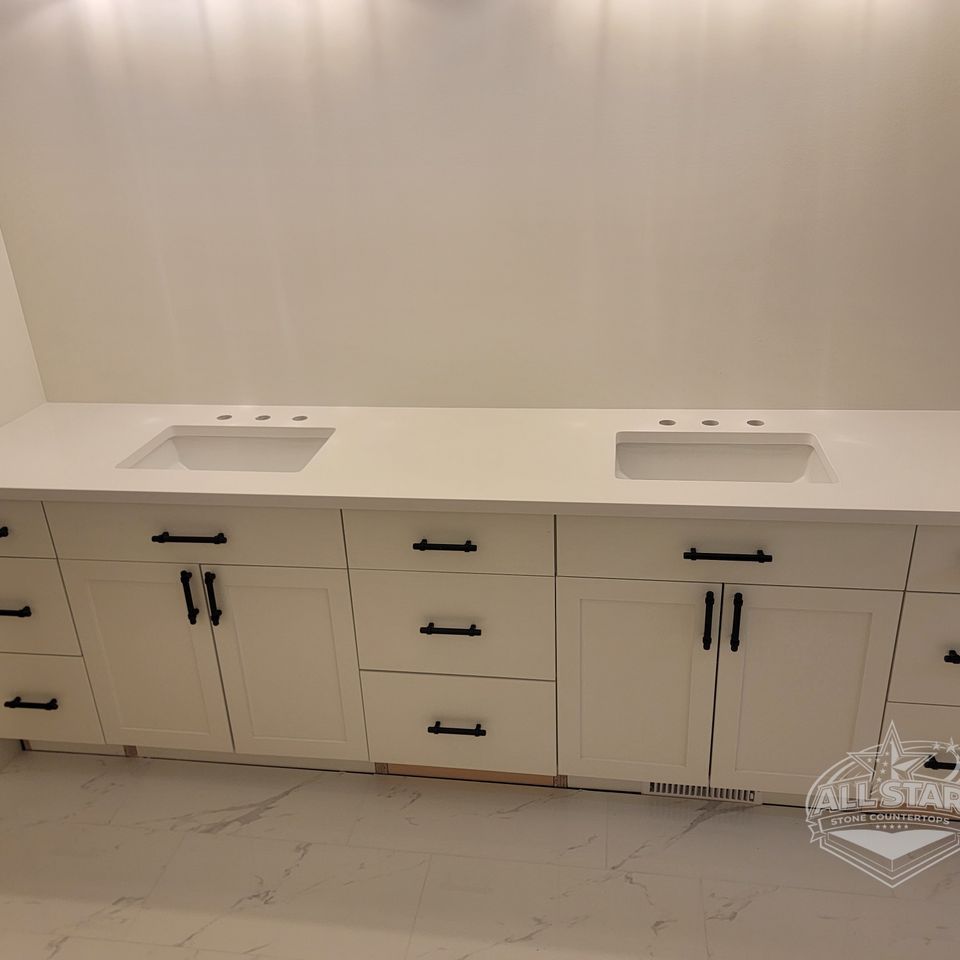Double-sink bathroom vanity with custom stone countertops in Houston, TX
