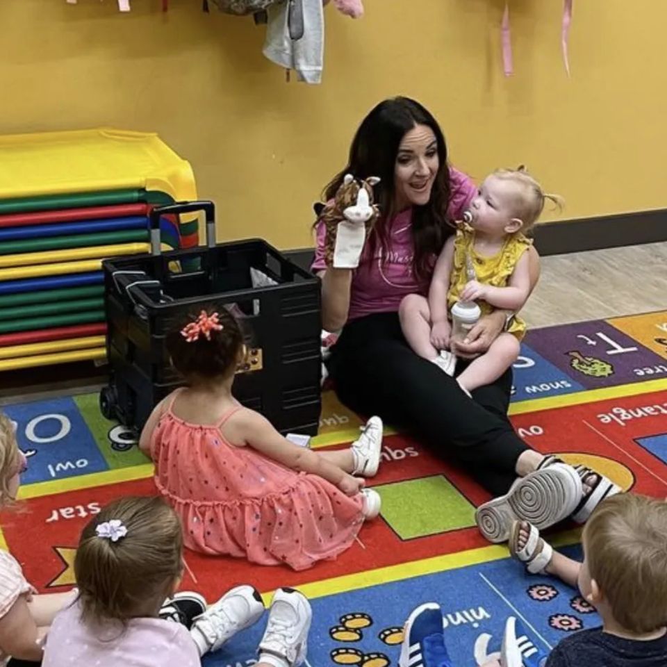 Miss Claire teaching music.
