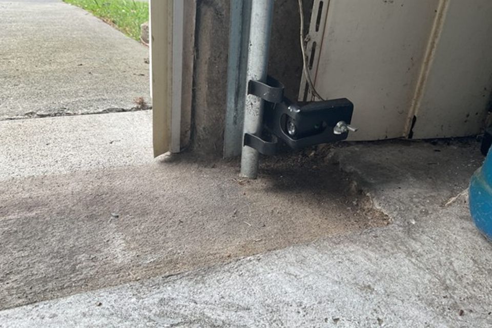 photo of garage door sensor, faulty garage door sensor, ready to roll garage doors