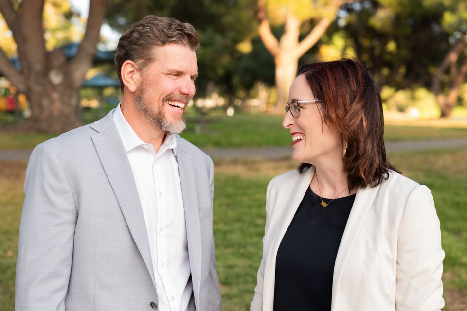Man and woman talking outdoors