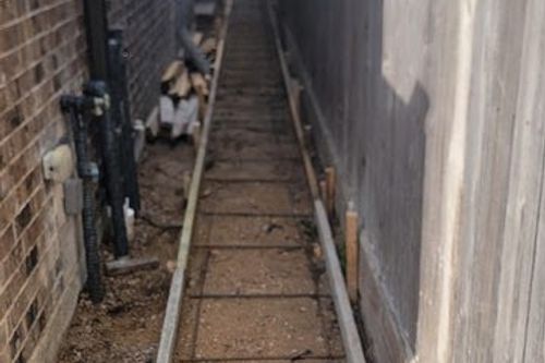 Forms and rebar ready for narrow concrete walkway in Magnolia, TX