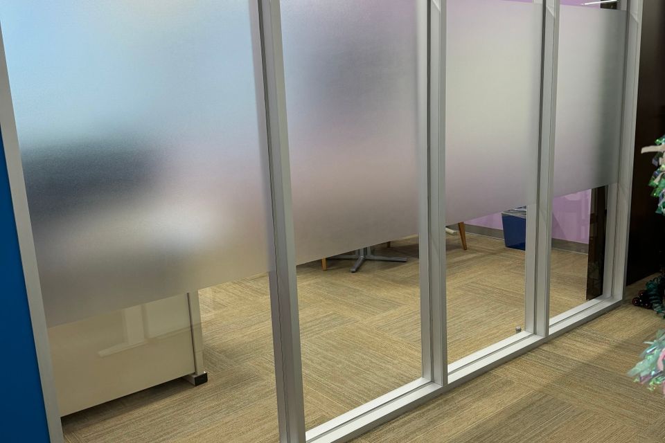 Decorative frosted window film applied to interior office glass in Sugar Land TX