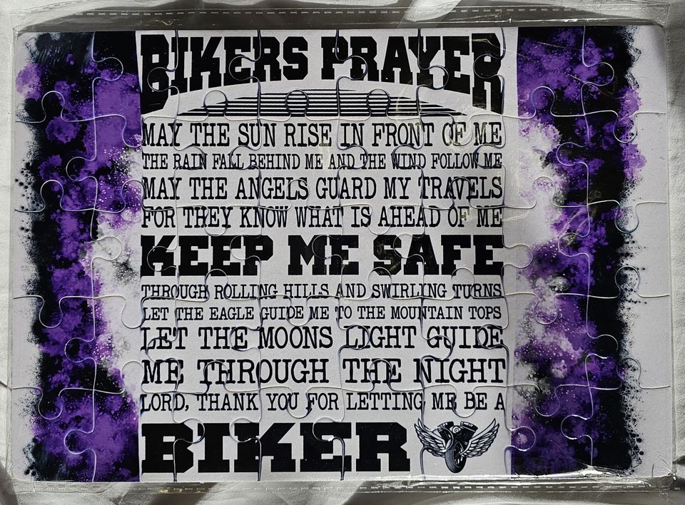 Custom puzzle displaying a biker prayer with purple accents and decorative motorcycle-themed artwork.