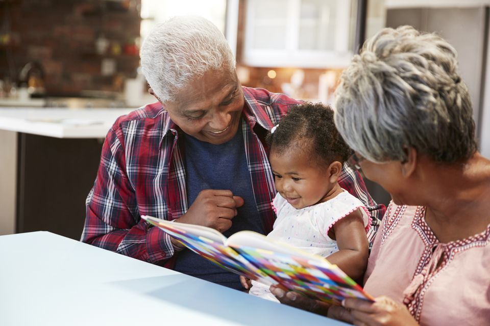 Grandparents babysitting reading