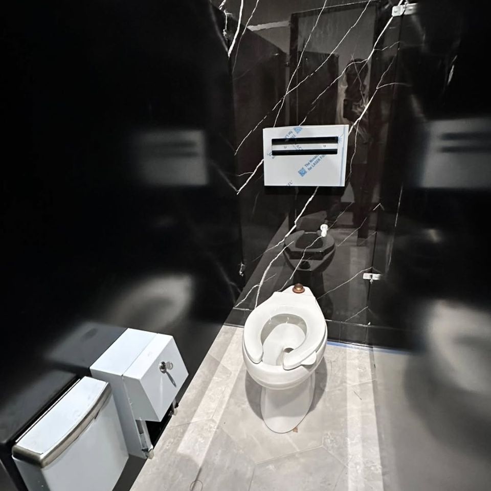 The inside view of a bathroom stall done by Pabst Leyton