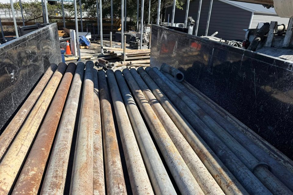 Scrap metal poles in the back of the JNJ Hauling Solutions truck