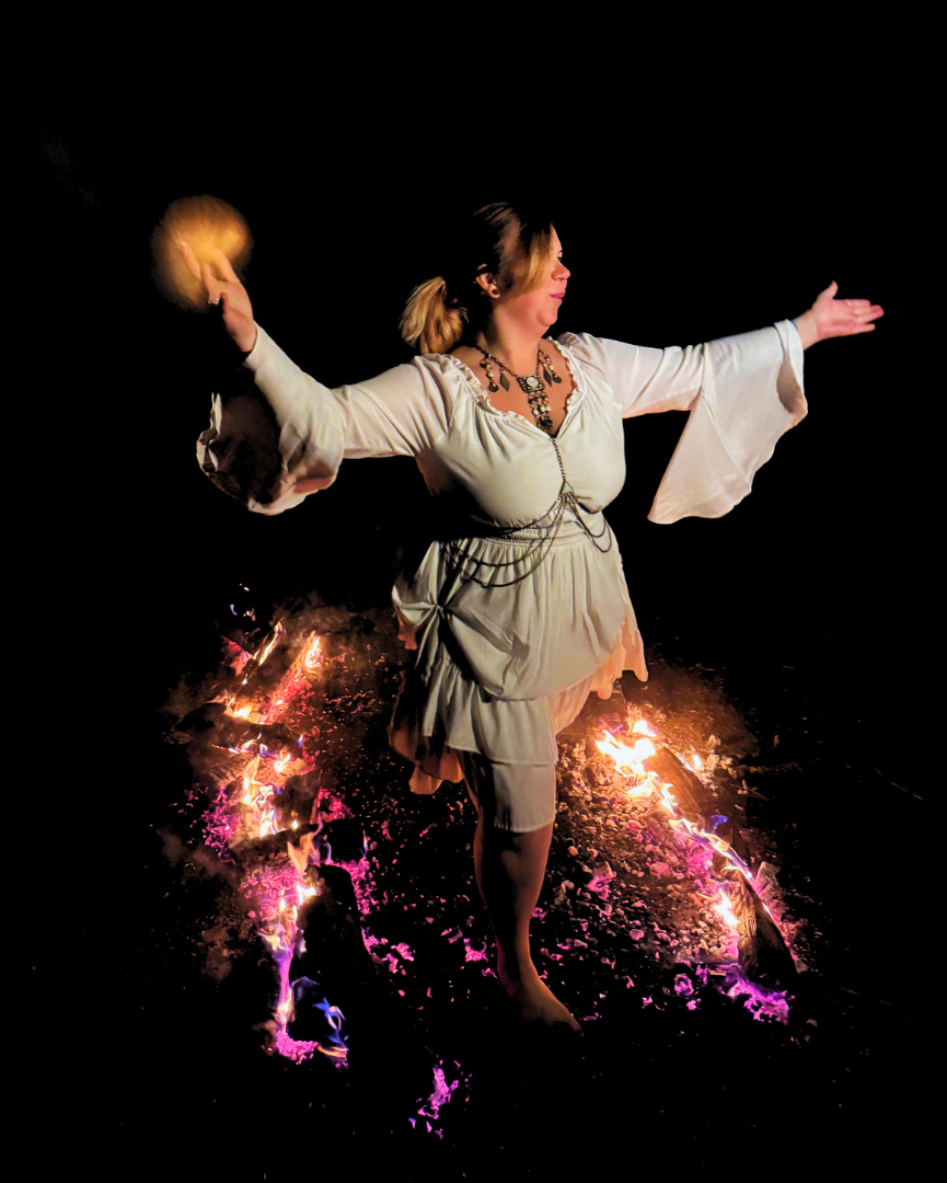 participant mid-stride across firewalk showing focus and determination