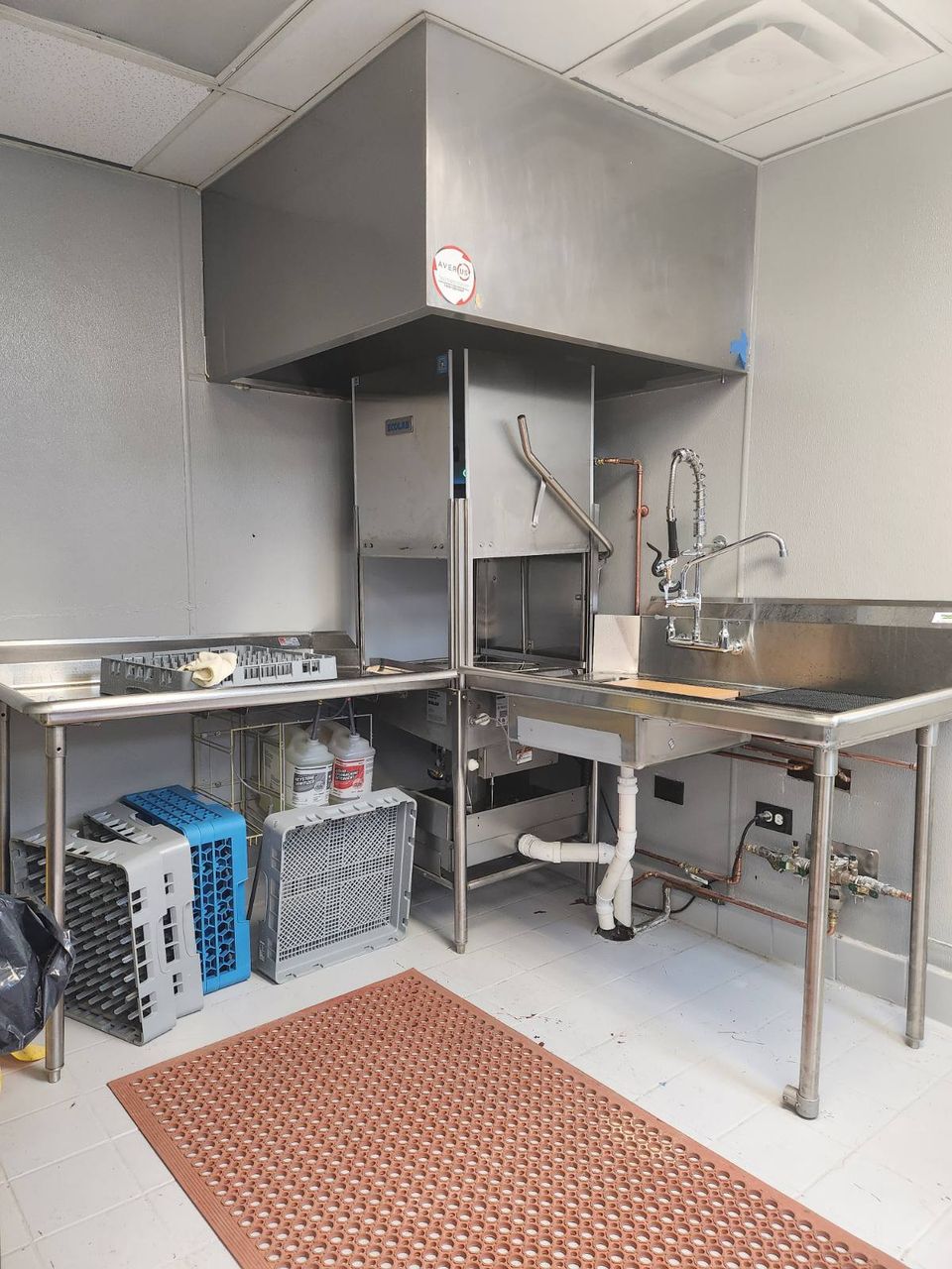 commercial restaurant dishwasher machine under hood ventilation system with clean and dirty side stainless steel tables