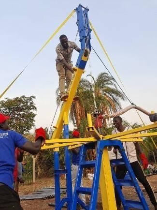 Drilling a borehole in gulu africa