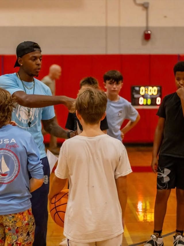Xavier Allen going over strategy during group training