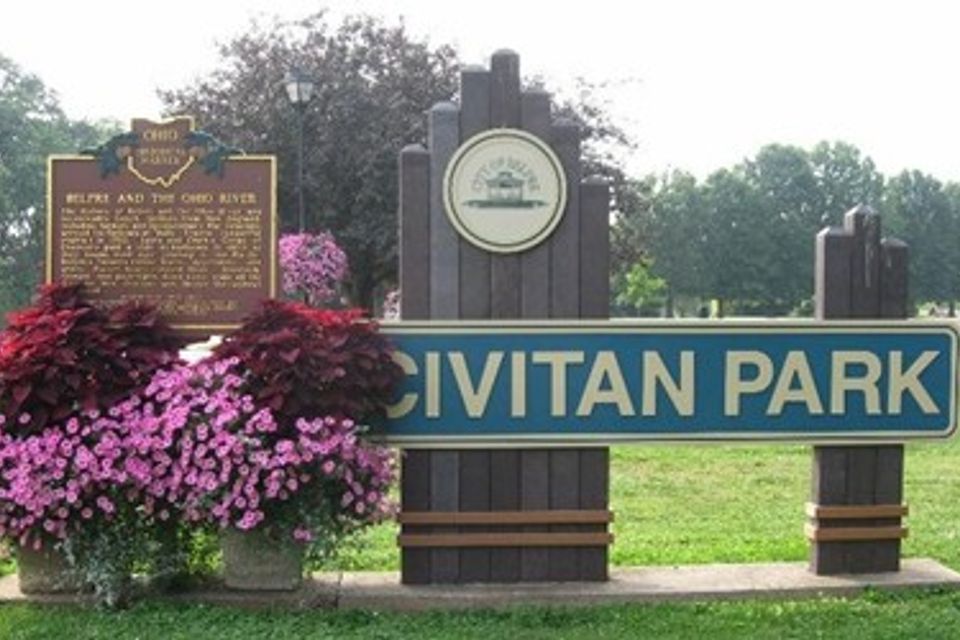 Civitan Park with the Civitan Park sign on the right and pink flowers on the left