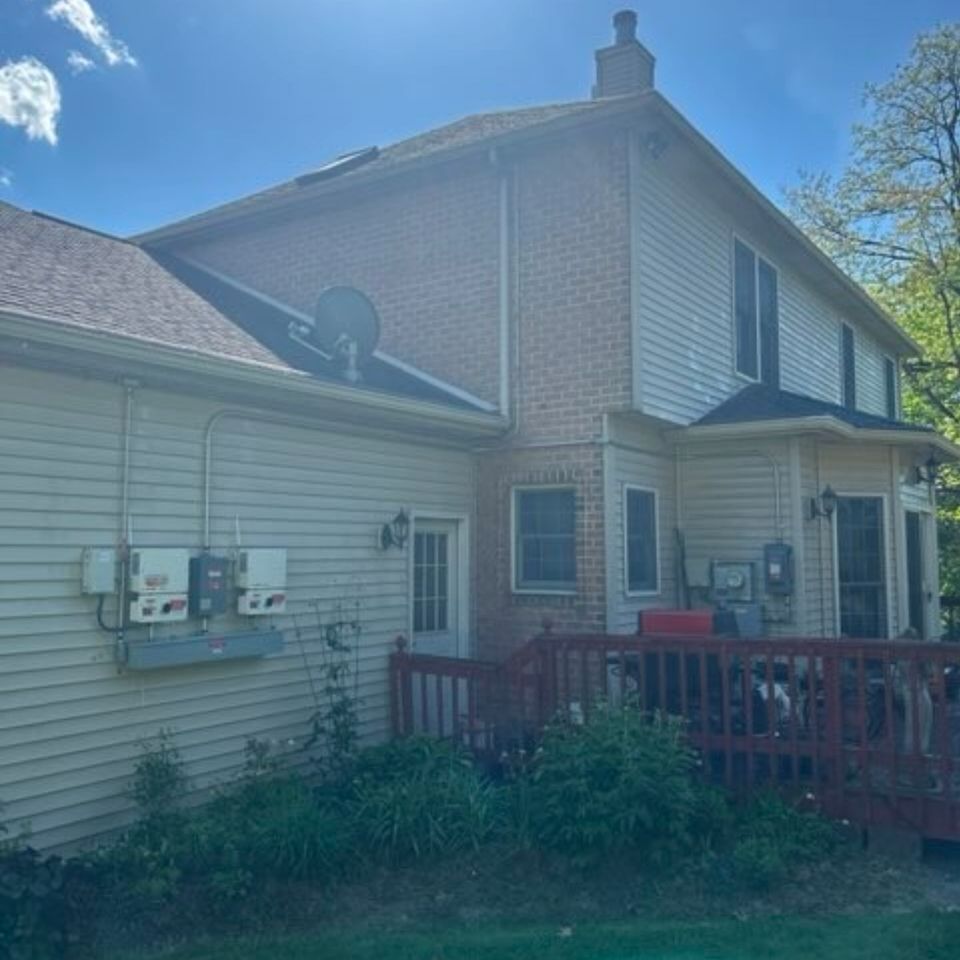 Brick and vinyl two-story home exterior after pressure washing in Harrisburg PA