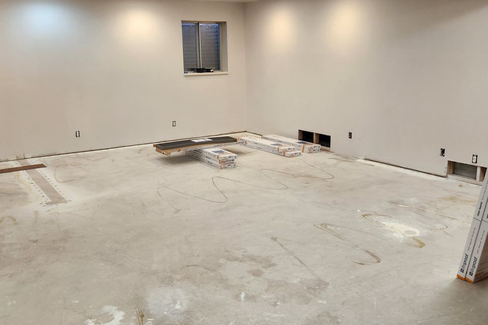 Basement flooring before