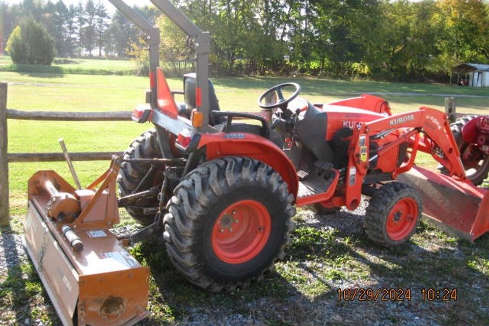 Kubota front end loader with tiller 15 000.