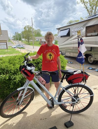 Judy Bowman standing with her bicycle