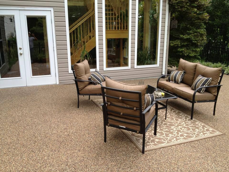 Modern outdoor patio featuring a decorative stone flooring system designed for residential and commercial spaces.