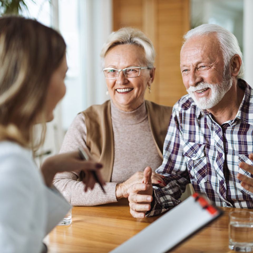 Couple talking with an insurance agent.