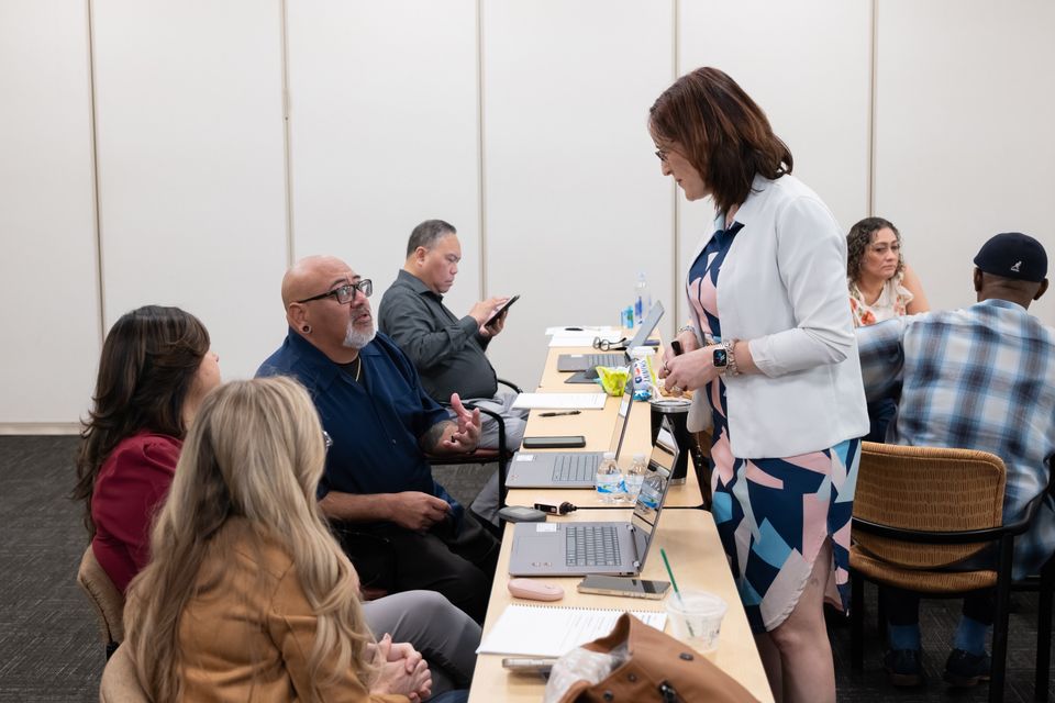 woman speaking to a group of people