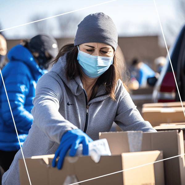 Non profit worker sorting boxes
