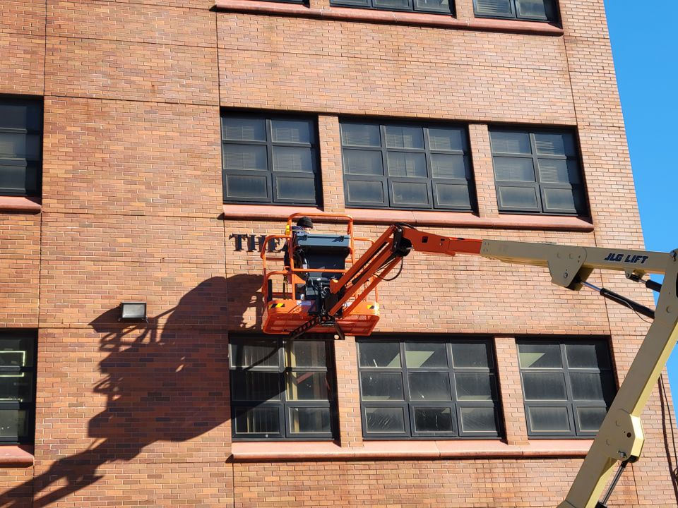 Dimensional letters mounted to brick