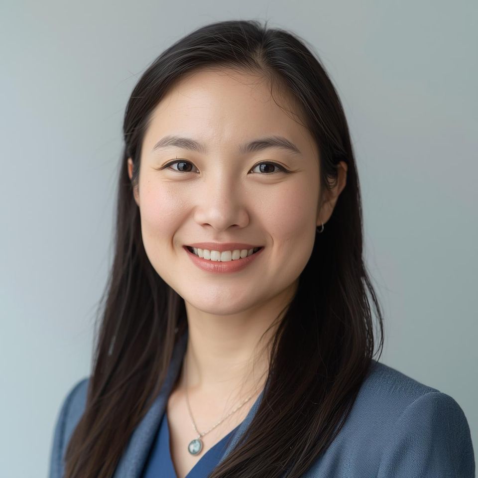Head and shoulders portrait of a young asian female lead caregiver