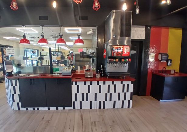 Modern commercial kitchen installation inside a pizza shop by Ultimate Kitchens.