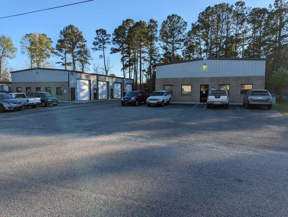 Exterior view of Car Doc Auto Repair Center at 553 Rainbow Drive, Garden City, SC, featuring the building, signage, and parking area.