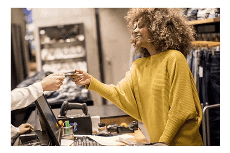 Retail worker accepting payment