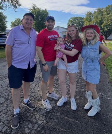 Family posing together with a baby at a Mahoning Valley Fourth of July event.