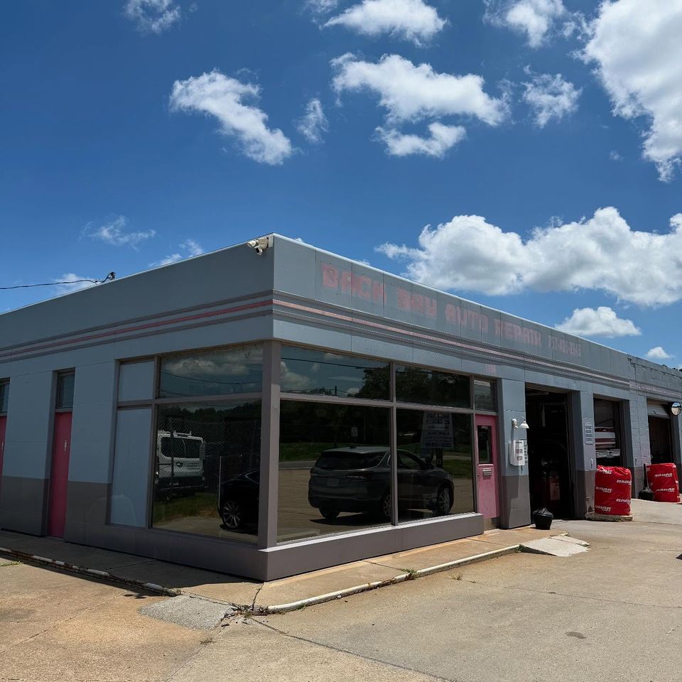 Back Bay Auto Repair shop exterior with large tinted storefront windows