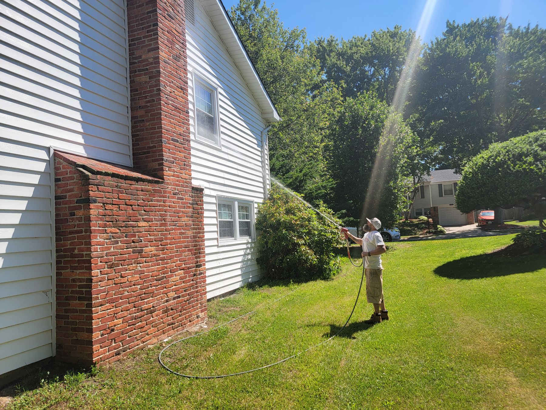 Pressure washing a home in Harford County and 
Baltimore County