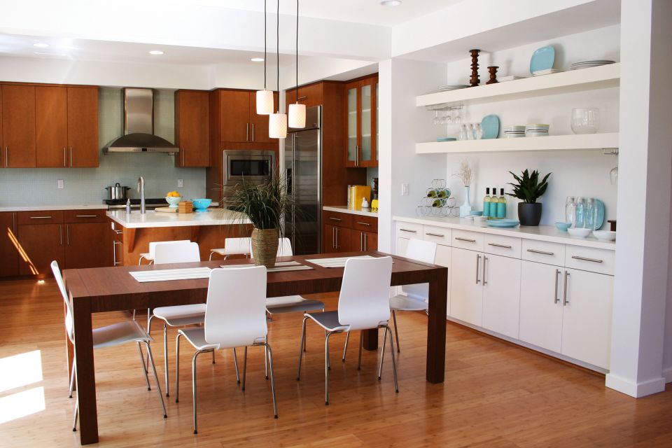 A nice and clean kitchen with sunlight glaring in