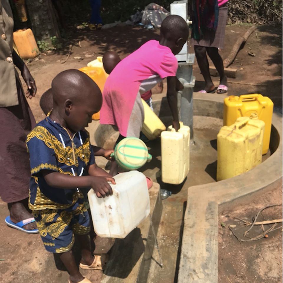 Atiak children enjoying clean water