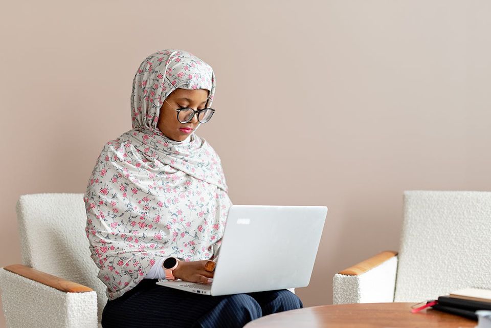 Muslim woman typing