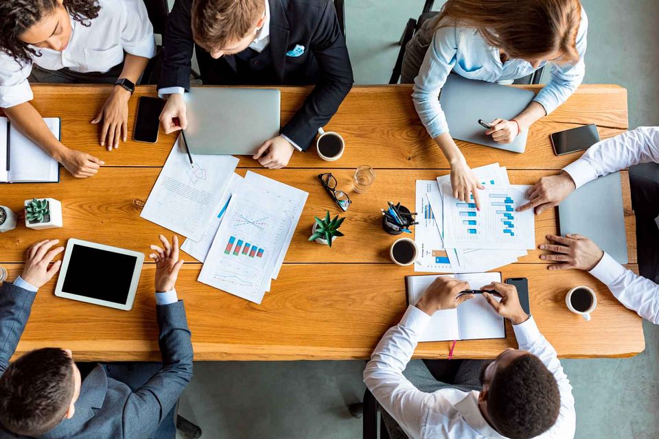 Group deciding different brand and marketing techniques to use for company in Houston, Texas
