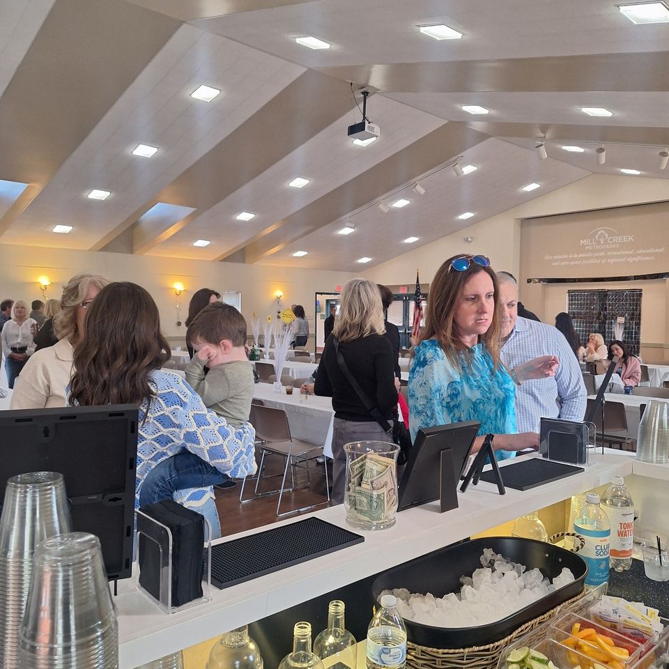 Guest ordering drinks at the retirement party