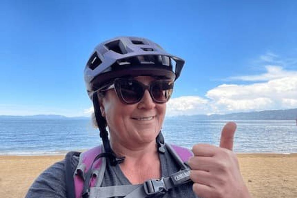 KPCopy embarking on her first bike ride since breaking her leg. At the beach with Lake Tahoe in the background