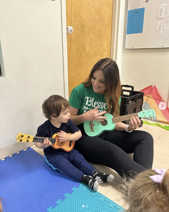 Miss Claire Teaching Ukulele