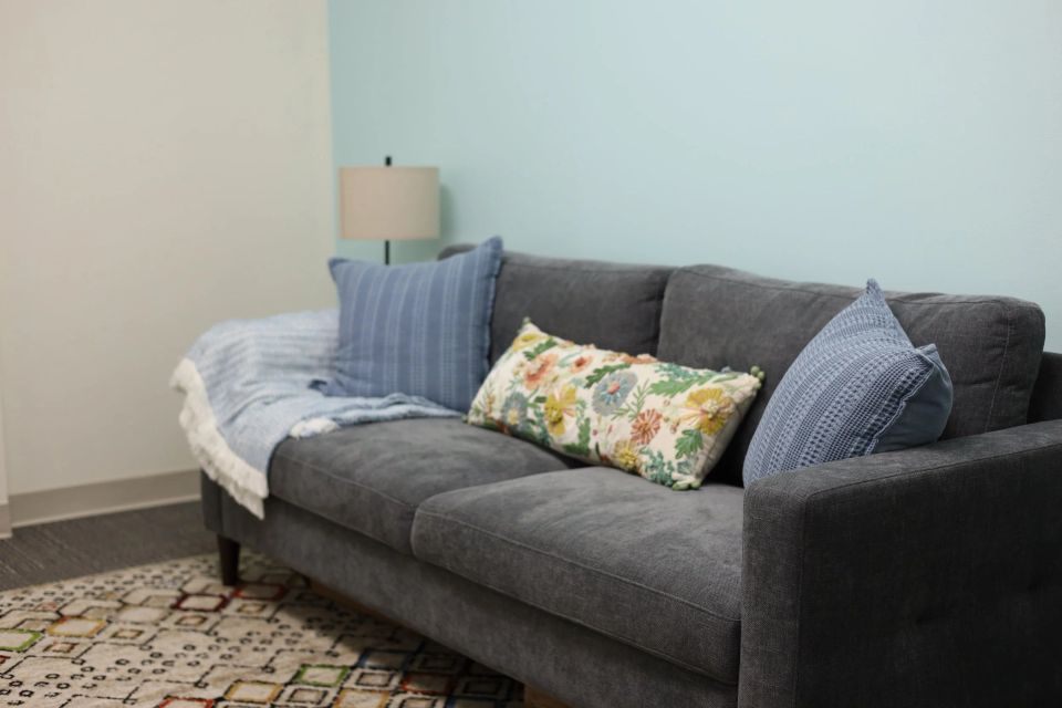 Comfortable couch in the welcoming counseling office at Reyes Collaborative Counseling in Houston, TX