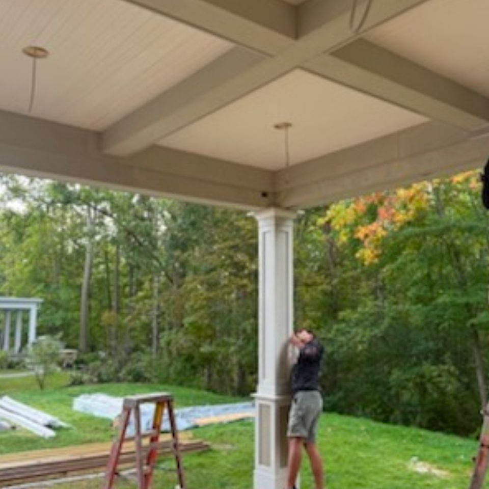 Coffered beadboard porch ceiling and square column trim installed during a residential remodel in Cleveland OH