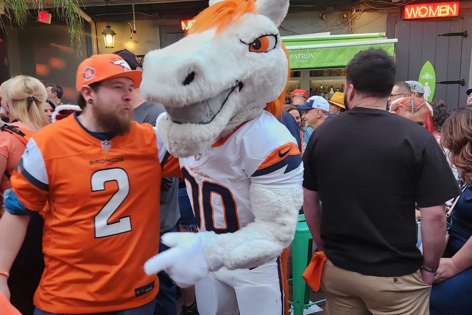Denver Broncos mascot interacting with fans at a Carpe Diem Events pre-game fan party in New Orleans