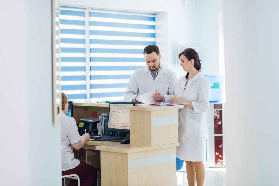 Busy reception in a hospital with doctors and rece 2024 11 03 00 46 48 utc (1)
