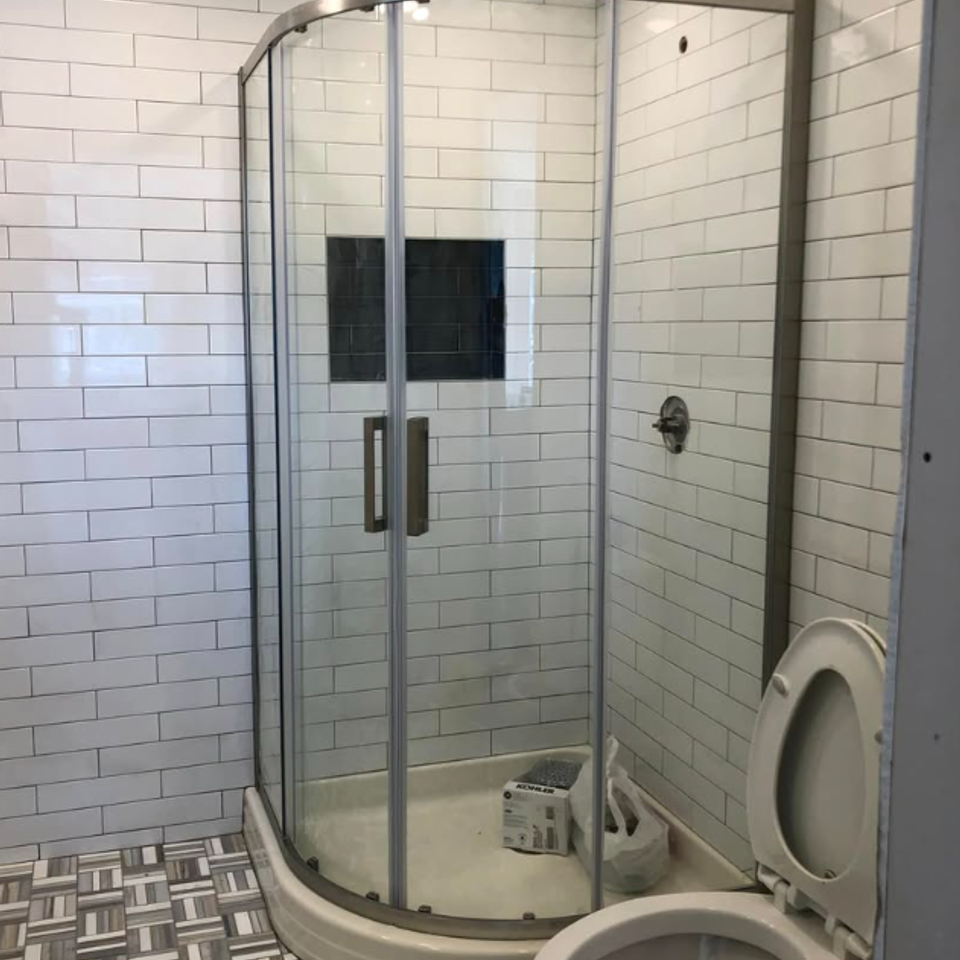 Subway tile shower black fixtures